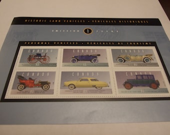 May include: A sheet of Canadian postage stamps featuring historic land vehicles. The stamps showcase various vintage cars, including a steam car, a touring car, and a sedan. The text "PERSONAL VEHICLES" is visible.