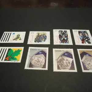 Surtido de 8 sellos postales navideños canadienses de 1994-1995.