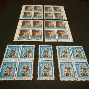 26 sellos postales navideños canadienses MINT de 1968,69 - 5 centavos - Familia esquimal y niños rezando.
