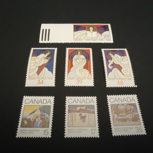 7 sellos postales navideños nuevos de 1980 y 1986: Ángeles de Navidad y Feliz Navidad.