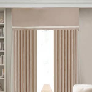 May include: Floor-length beige curtains with vertical pleats and a matching valance featuring a horizontal white stripe. The curtains hang over a window, framing a view of a white lamp on a pedestal stand, positioned between the fabric panels.