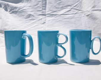 Handmade Light Blue Porcelain Mug: Unique Handle Designs