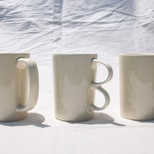 Handmade Porcelain Coffee Mug: Mustard Glaze, Unique Handle