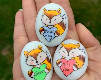 Personalised Fox holding a heart pocket hug pebble ,