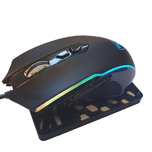 May include: A black wired gaming mouse with a blue and green LED light strip along the side. The mouse has a textured grip and multiple buttons.