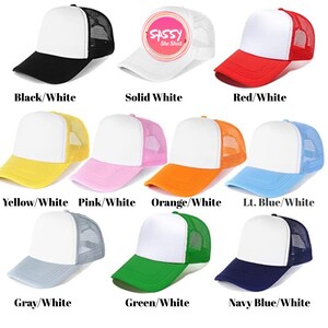 May include: Ten trucker hats in various colours with white front panels and mesh back panels. The hats are arranged in two rows of five. The colours are black, white, red, yellow, pink, orange, light blue, grey, green, and navy blue.