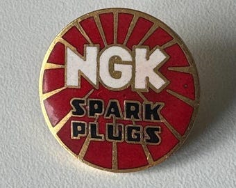 NGK Spark Plugs Logo Pin – Enamel Brand Badge for Collectors