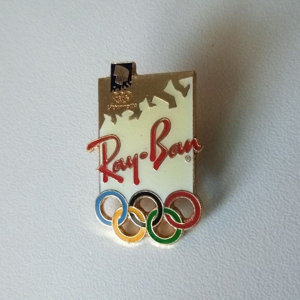 Ray-Ban: Der Sponsor-Pin mit dem Olympischen Logo (Lillehammer 1994)