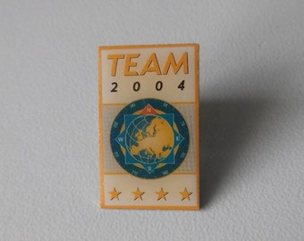 Show your Opel love with our OPEL TEAM 2004 Pin!