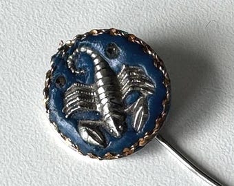 1960s Scorpio lapel pin – blue emblem with silver motif and gold‑tone border