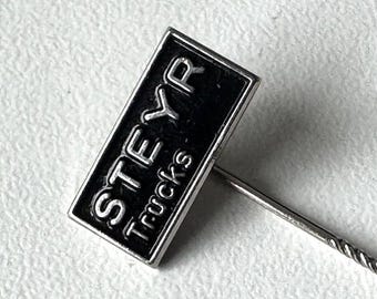 Steyr Trucks lapel badge embossed – black logo script – 1980s period original – collector piece