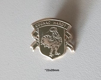 Pure Elegance: 90s Cognac Hardy Logo Pin