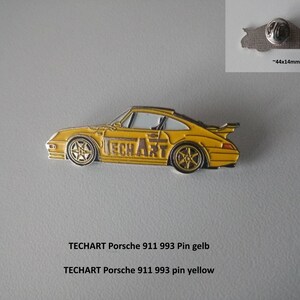 May include: Yellow Porsche 911 993 pin with "TECHART" written on the side. The pin is 44mm x 14mm.