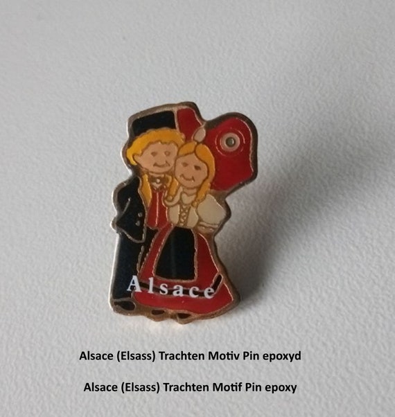 Experience the beauty of Alsace with the traditional costume pin!