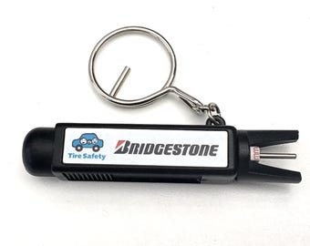 Safety on the Go – Bridgestone Tire Gauge Keychain with FIA Foundation Branding