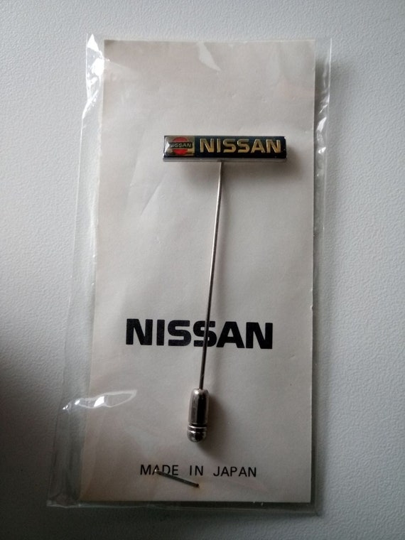 NISSAN logo lettering originally packaged contemporary witness