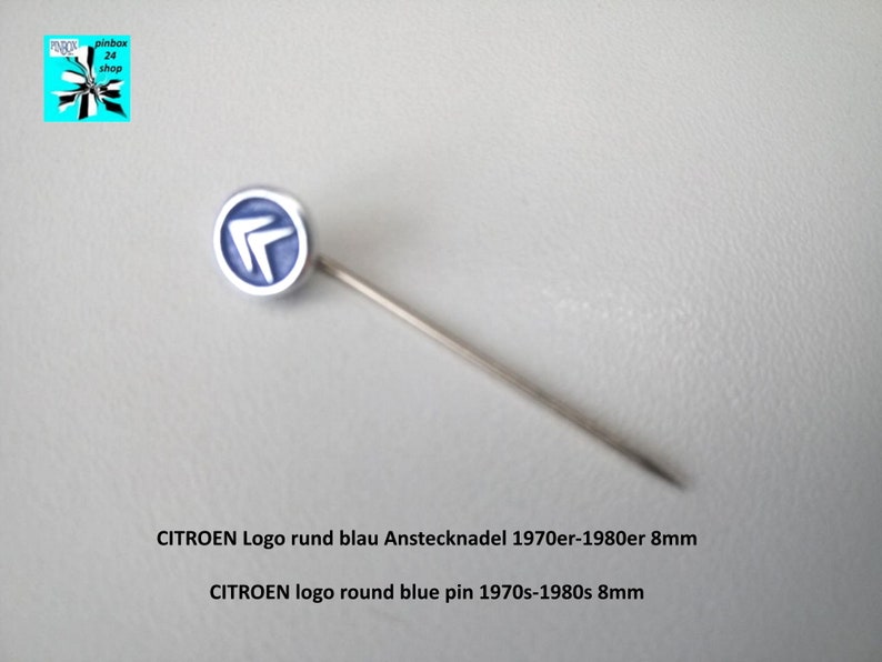 May include: A blue and silver round pin with the Citro&euml;n logo. The pin is 8 mm in diameter and dates back to the 1970s-1980s.