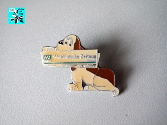 Dog with newspaper (WZ Westdeutsche Zeitung) Comic Pin epoxy from 1994 - 1.14x0.91 inches