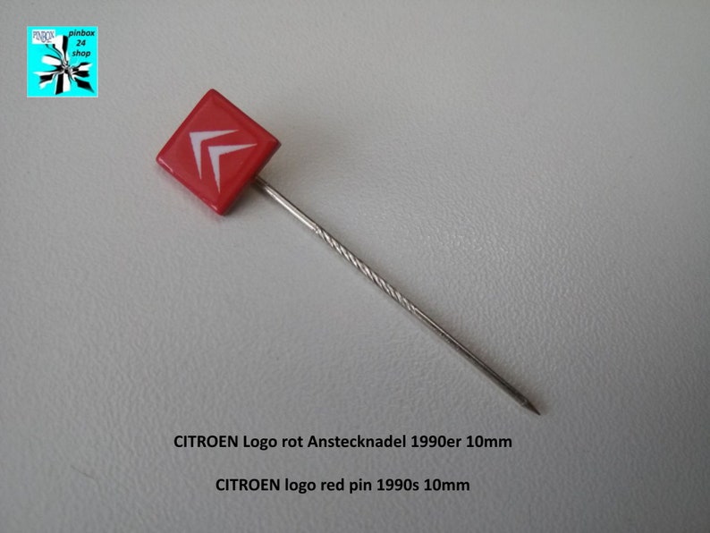 May include: Red enamel pin with a white Citroen logo. The pin is 10mm in size and is on a silver pin back.