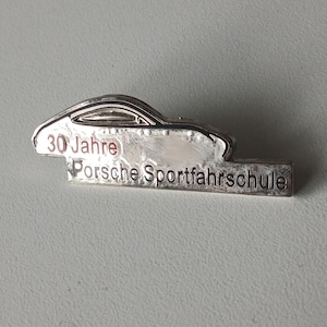 Silver Legacy – Porsche Pin Featuring Iconic 911 Silhouette