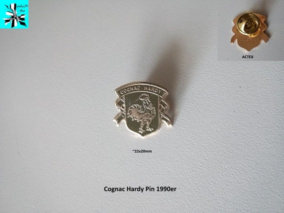 Pure Elegance: 90s Cognac Hardy Logo Pin