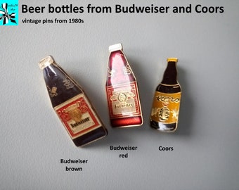 Beer bottle pins from Budweiser and Coors, 1980s
