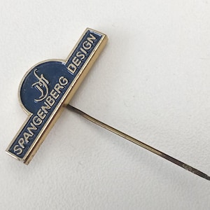Vintage Spangenberg Design Pin – Rare Aluminum Logo Badge 80s Era