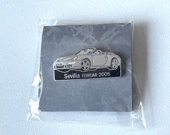 Porsche 911 Carrera 4S Cabrio press pin Seville February 2005 – factory‑sealed presentation motif
