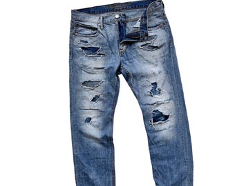Vaqueros unisex únicos y raros de estilo vintage con parches, reelaborados, deshilachados, rotos y parcheados, hechos a mano, estilo boro japonés, herencia sashiko.