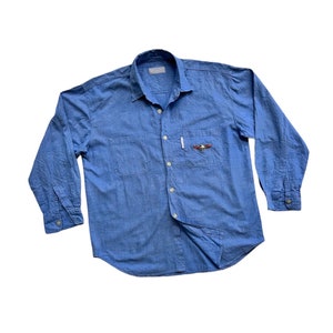 Camisa vaquera índigo de Chambray azul ligera vintage auténtica y rara, con bolsillo bordado, manga larga, tendencia de moda, ropa de trabajo, retro, clásica, única