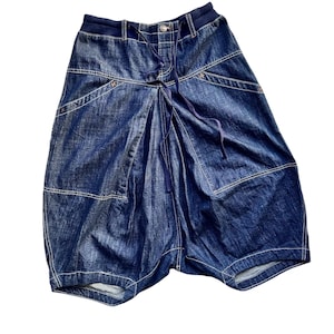 May include: A pair of dark blue denim shorts with a drawstring waist and multiple pockets.
