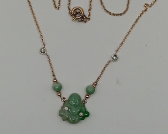 A Vintage untreated jade buddha and diamond 14kt gold necklace