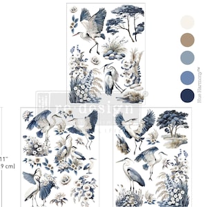 May include: Decorative transfer sheets featuring watercolor illustrations of herons, flowers, and trees in shades of blue, white, and brown. The sheets measure 11 inches (27.9 cm) by 8.5 inches (21.5 cm).