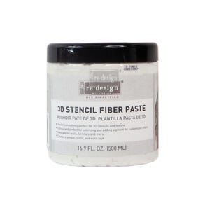 May include: A white plastic jar with a black lid contains 16.9 fl oz (500 ml) of 3D stencil fiber paste. The label reads "re-design" and lists the product as a stencil paste for adding texture and color to walls and furniture.