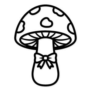 Può includere: Illustrazione in bianco e nero di un fungo con un fiocco. Il cappello del fungo presenta un motivo a pois. Lo stelo è allungato e un fiocco adorna la base. L'immagine è un semplice disegno a tratto.