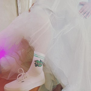 Bride wearing Green Riot Tofu Love socks