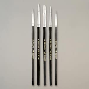 May include: Five Pro Arte Scholar paint brushes with black handles and silver ferrules. The white brush heads have different shapes, including round, pointed, and flat. The brushes are displayed vertically against a neutral background.