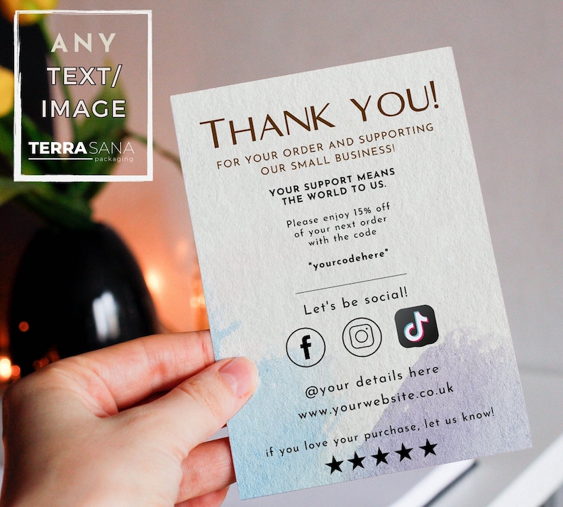 May include: A rectangular thank you card with a textured white paper finish, featuring blue and purple watercolor accents at the bottom. The text reads THANK YOU! FOR YOUR ORDER AND SUPPORTING OUR SMALL BUSINESS! YOUR SUPPORT MEANS THE WORLD TO US.