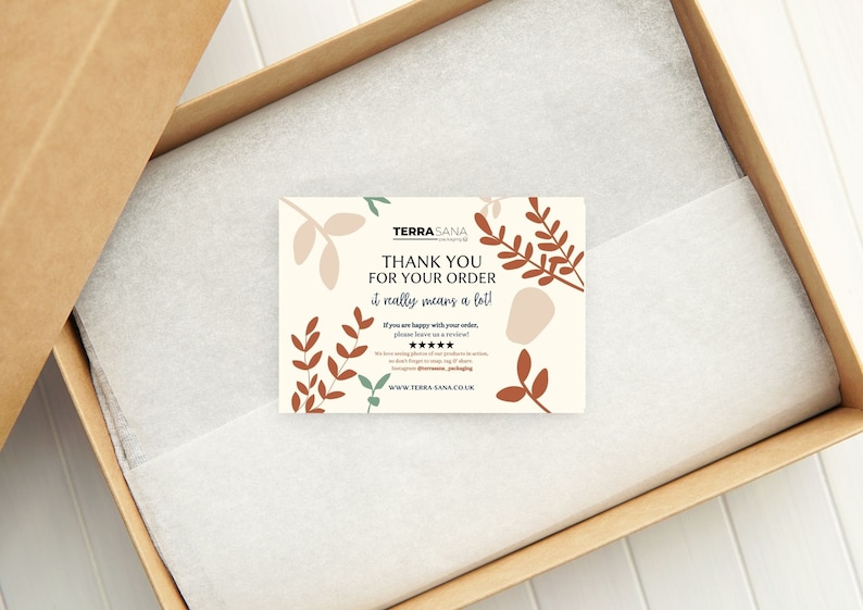 May include: A rectangular thank you card with a cream background and rust-colored leaf illustrations. The text reads: TERRA SANA, THANK YOU FOR YOUR ORDER, it really means a lot!, If you are happy with your order, please leave us a review!, five stars, and WWW.TERRA-SANA.CO.UK.