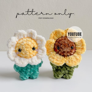 May include: Two crocheted flower plushies. One is a daisy with a white petal, yellow center, and teal base. The other is a sunflower with yellow petals, a brown center, and a green base. The text "pattern only" and "PDF DOWNLOAD" is visible.