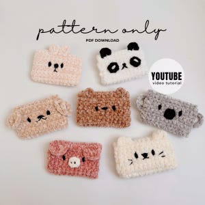 May include: A selection of handmade, plush animal-themed phone cases in shades of pink, white, brown, and grey. Each case is embroidered with details to resemble a panda, bear, koala, pig, cat, and dog. The text "pattern only" and "PDF DOWNLOAD" is visible.
