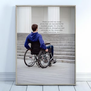 May include: Framed print featuring a person in a wheelchair facing a set of stairs. The person is wearing a blue hoodie and jeans. The print includes text advocating for the Americans with Disabilities Act.