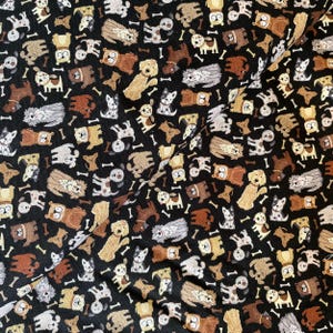 May include: Black fabric featuring a repeating pattern of dogs and bones. The dogs are in various shades of brown, tan, and white. The bone shapes are scattered throughout the design, creating a fun and playful pattern.