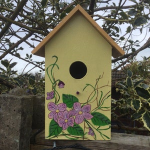 Lovely little hand painted bird house.