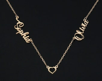 May include: A gold necklace with two names, "Sophia" and "Olivia", connected by a heart charm. The necklace is made of 92K sterling silver.