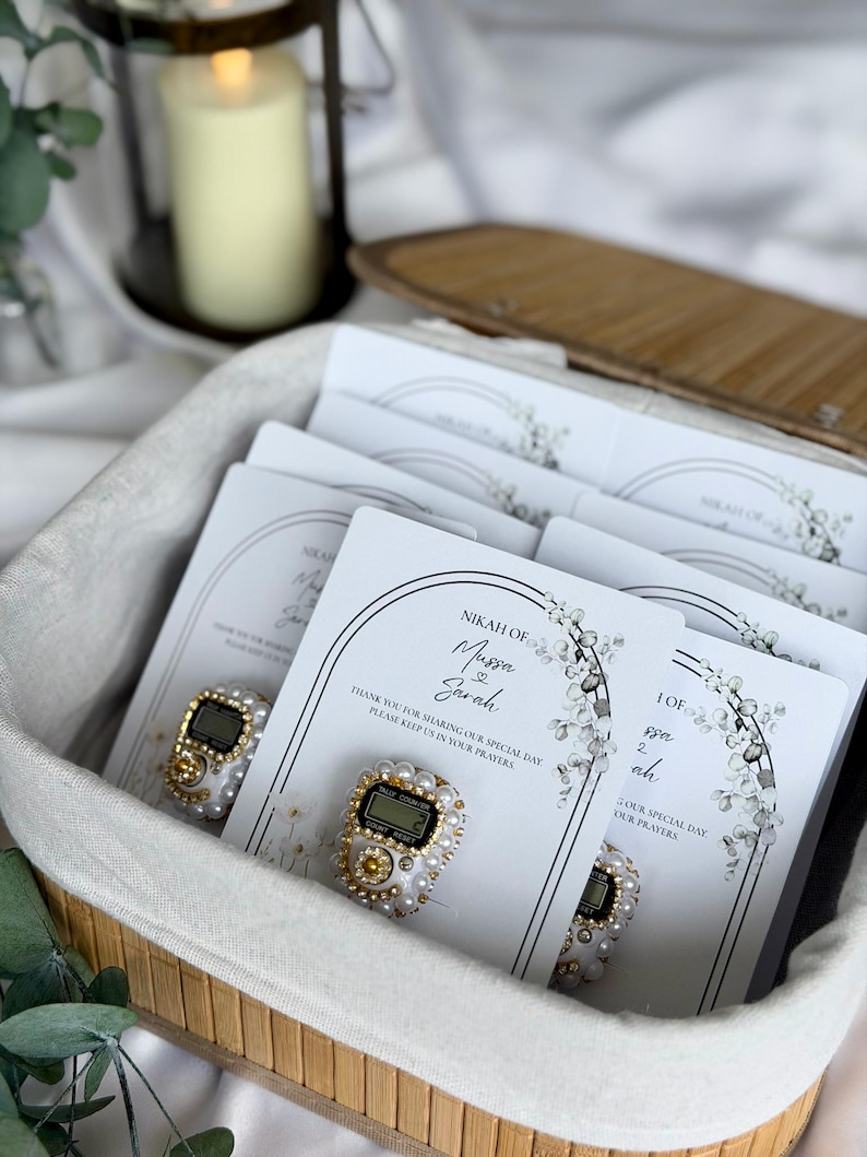 Custom Nikkah favor with digital prayer counter, personalized Muslim wedding keepsake featuring floral artwork, couple names, and wedding date for guests.