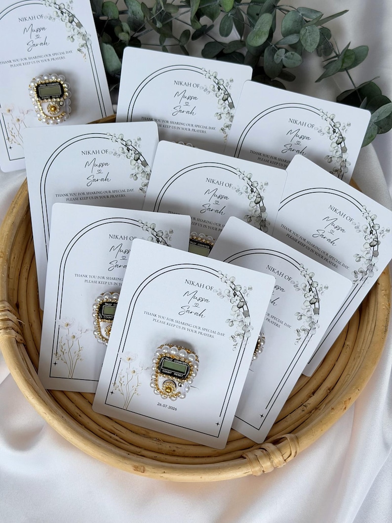 Custom Nikkah favor with digital prayer counter, personalized Muslim wedding keepsake featuring floral artwork, couple names, and wedding date for guests.