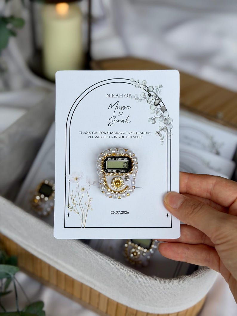 Custom Nikkah favor with digital prayer counter, personalized Muslim wedding keepsake featuring floral artwork, couple names, and wedding date for guests.