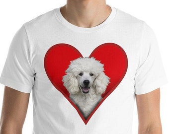 May include: White t-shirt with a red heart design featuring a white poodle inside the heart.