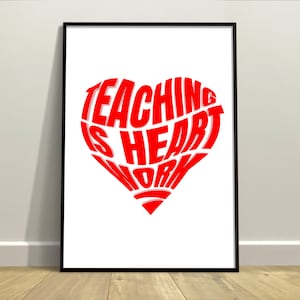 May include: A red heart-shaped graphic with the text "Teaching is heart work" inside. The graphic is on a white background and framed in black.